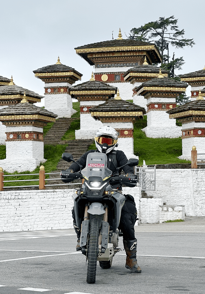 A rider on an adventure motorcycle in Bhutan.