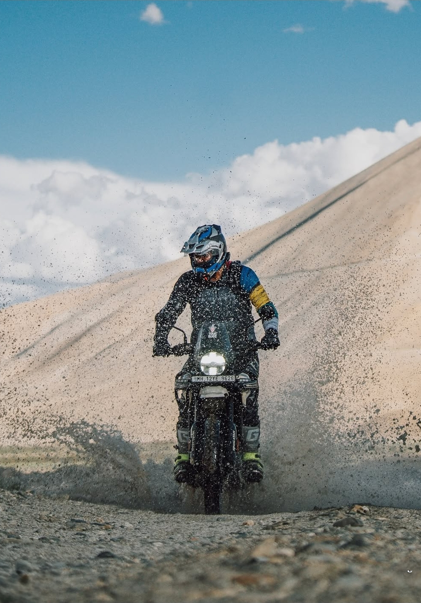 A rider on an adventure motorcycle in Ladakh
